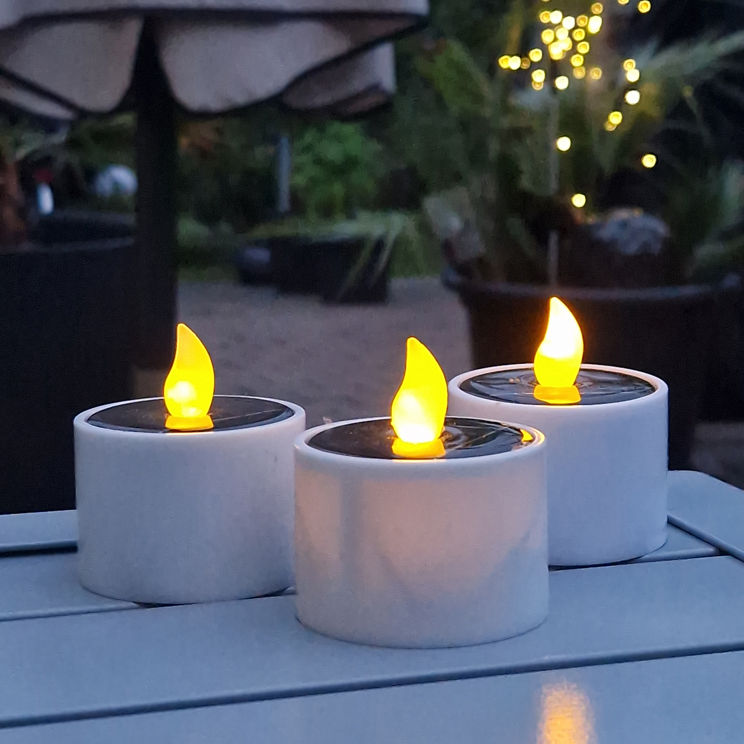 LED Solar Teelichter - orange flackernde LED - Lichtsensor - H: 6cm/D: 5,2cm - für Außen - 3er Set