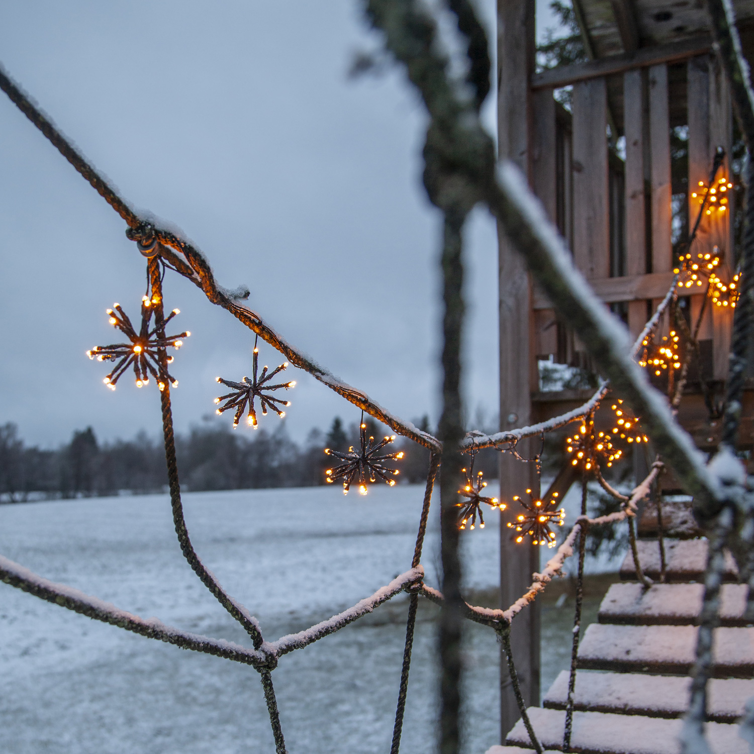 LED Lichterkette Feuerwerk - 200 bernsteinfarbene LED - 10 Cluster - L: 4m - Trafo - Außen - schwarz
